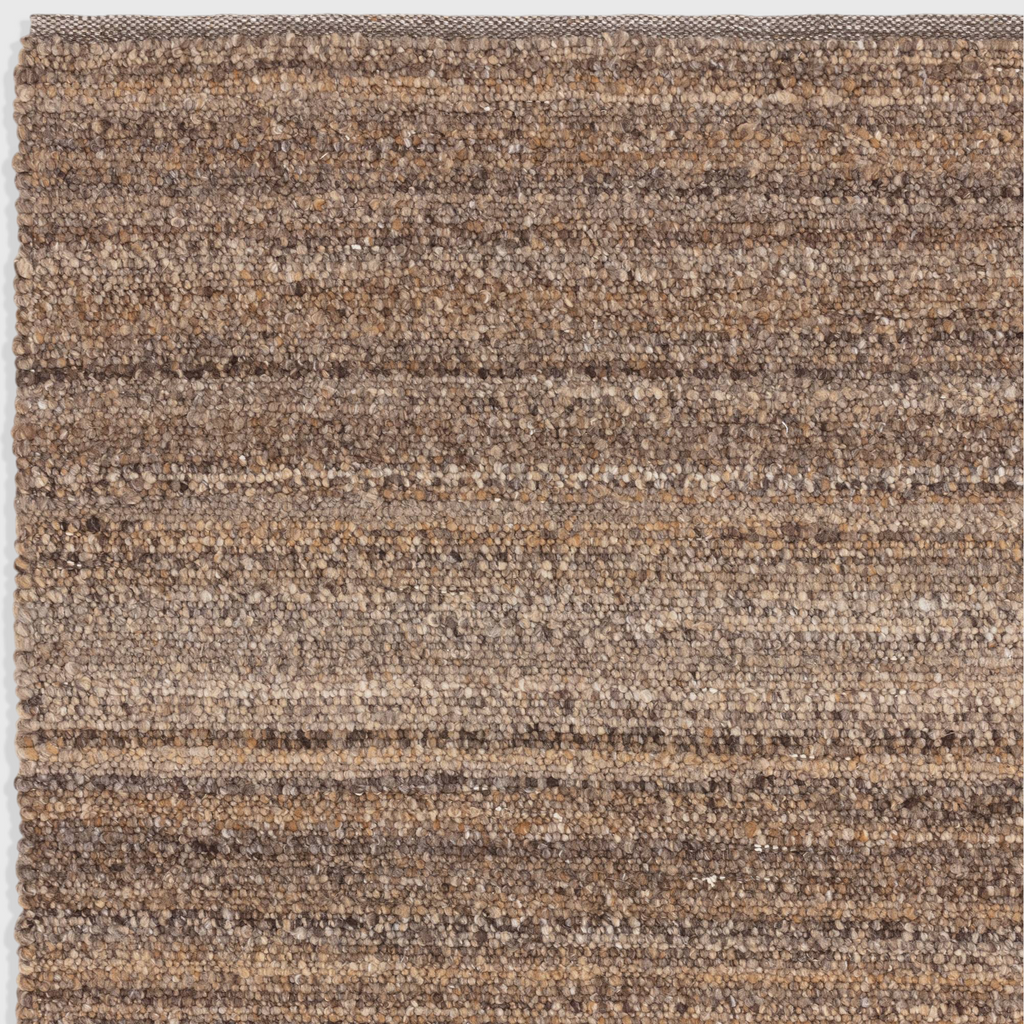 Alvo Rugs Abella tawny brown hand woven polyester boucle rug with a textured boho flatweave pile design.