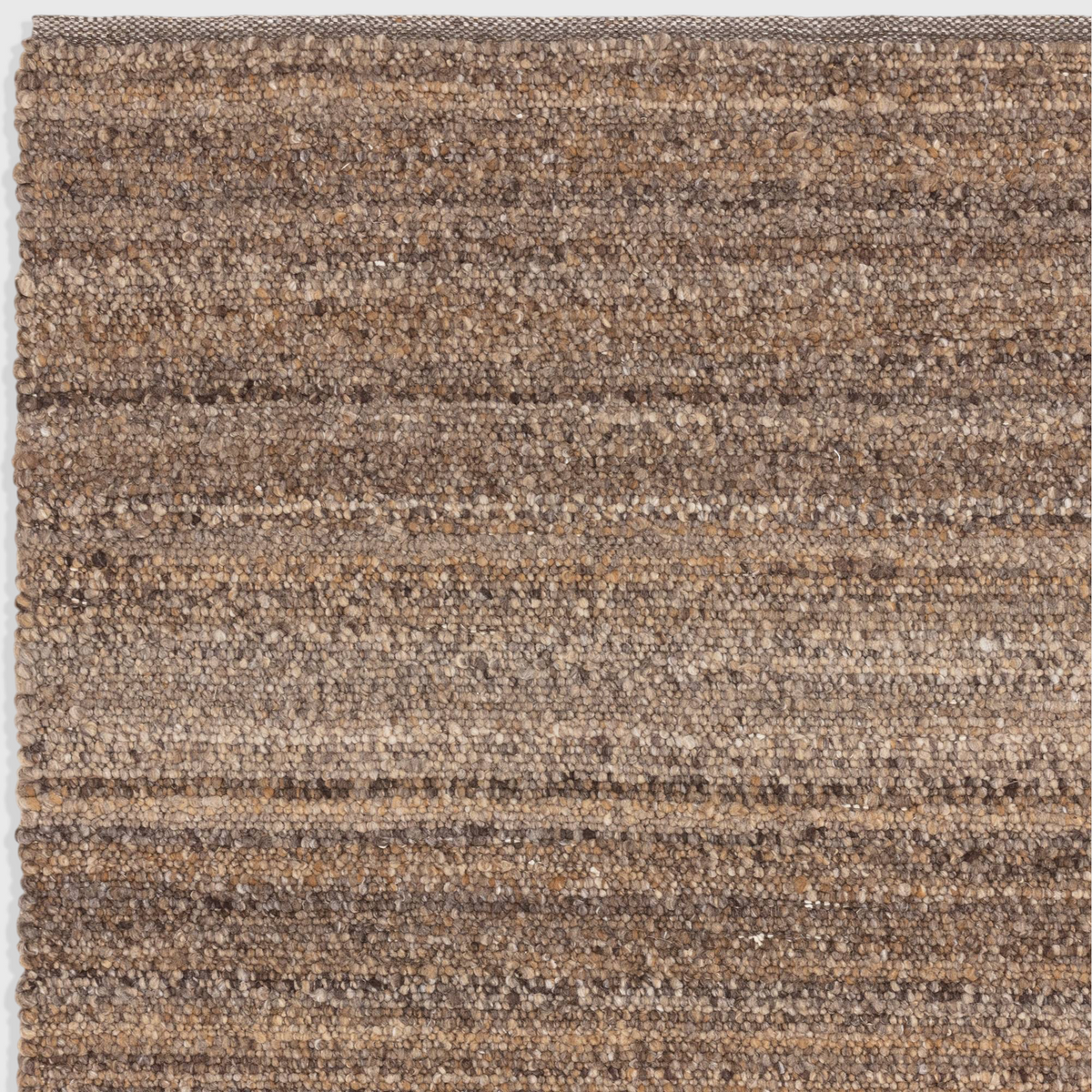 Alvo Rugs Abella tawny brown hand woven polyester boucle rug with a textured boho flatweave pile design.