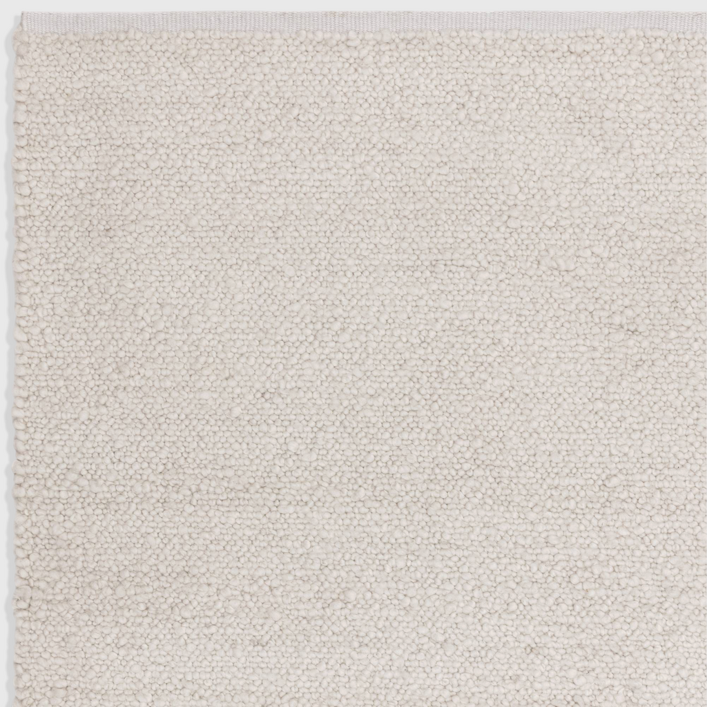Alvo Rugs Abella ivory boucle rug with a soft hand-woven polyester texture and boho style flatweave design