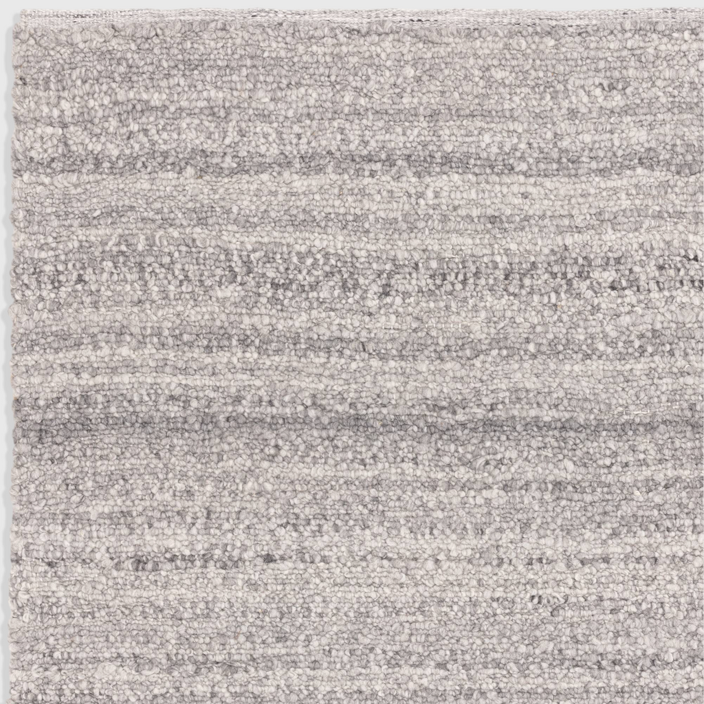 Alvo Rugs Abella Steel grey boucle rug with a textured hand-woven flatweave finish and boho aesthetic