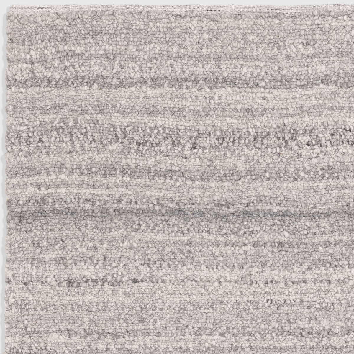 Alvo Rugs Abella Steel grey boucle rug with a textured hand-woven flatweave finish and boho aesthetic
