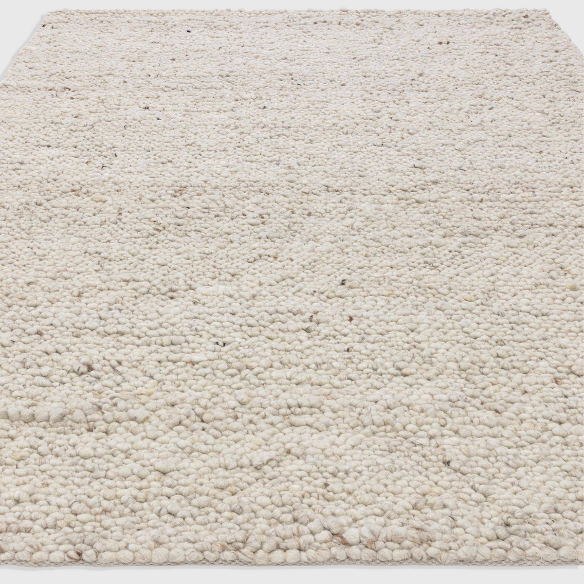 Alvo Rugs Adio ivory wool rug with a chunky hand-woven boucle texture and soft cream loop pile finish.