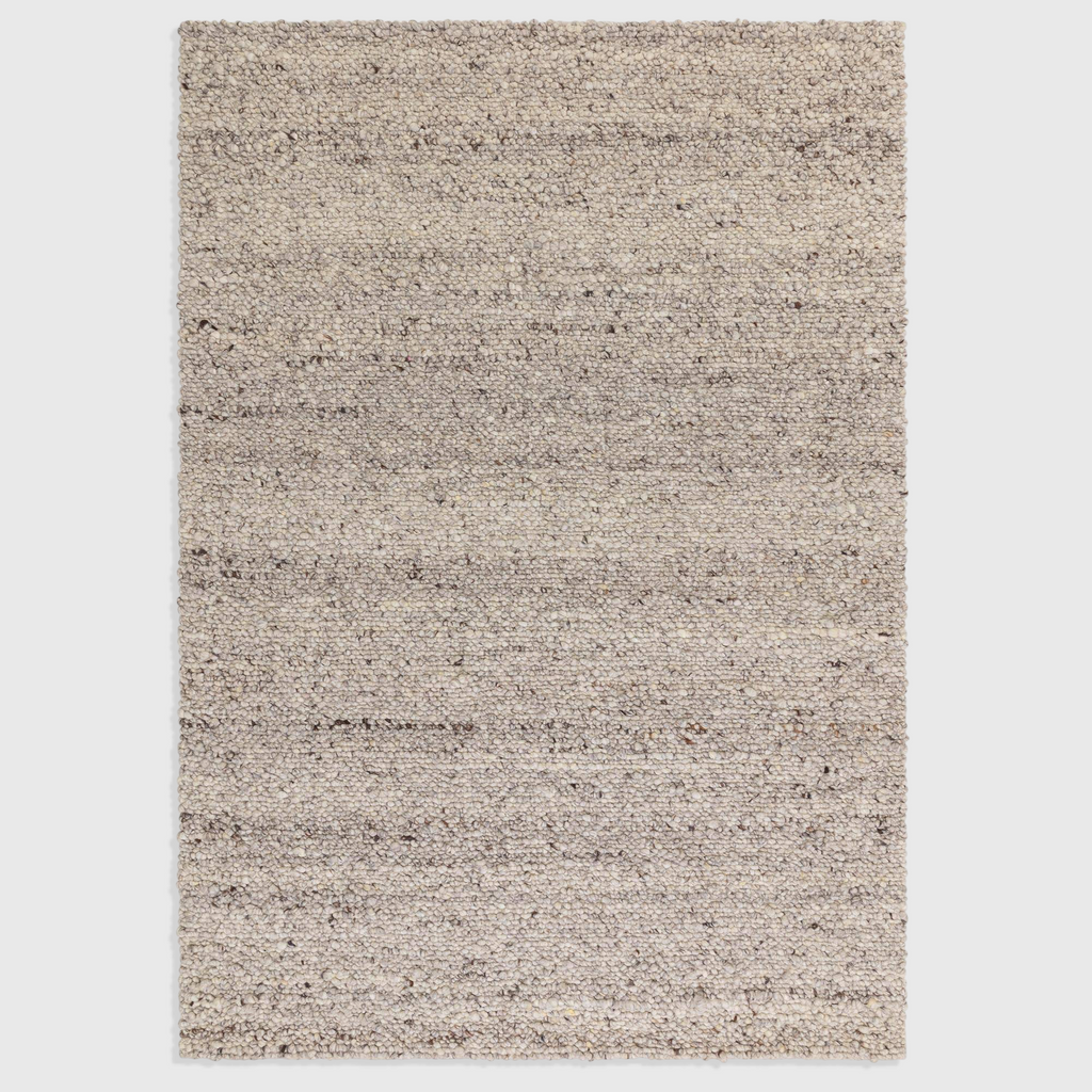 Alvo Rugs Adio silver hand-woven wool rug with a chunky boucle loop pile texture in neutral grey tones.