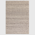 Alvo Rugs Adio silver hand-woven wool rug with a chunky boucle loop pile texture in neutral grey tones.