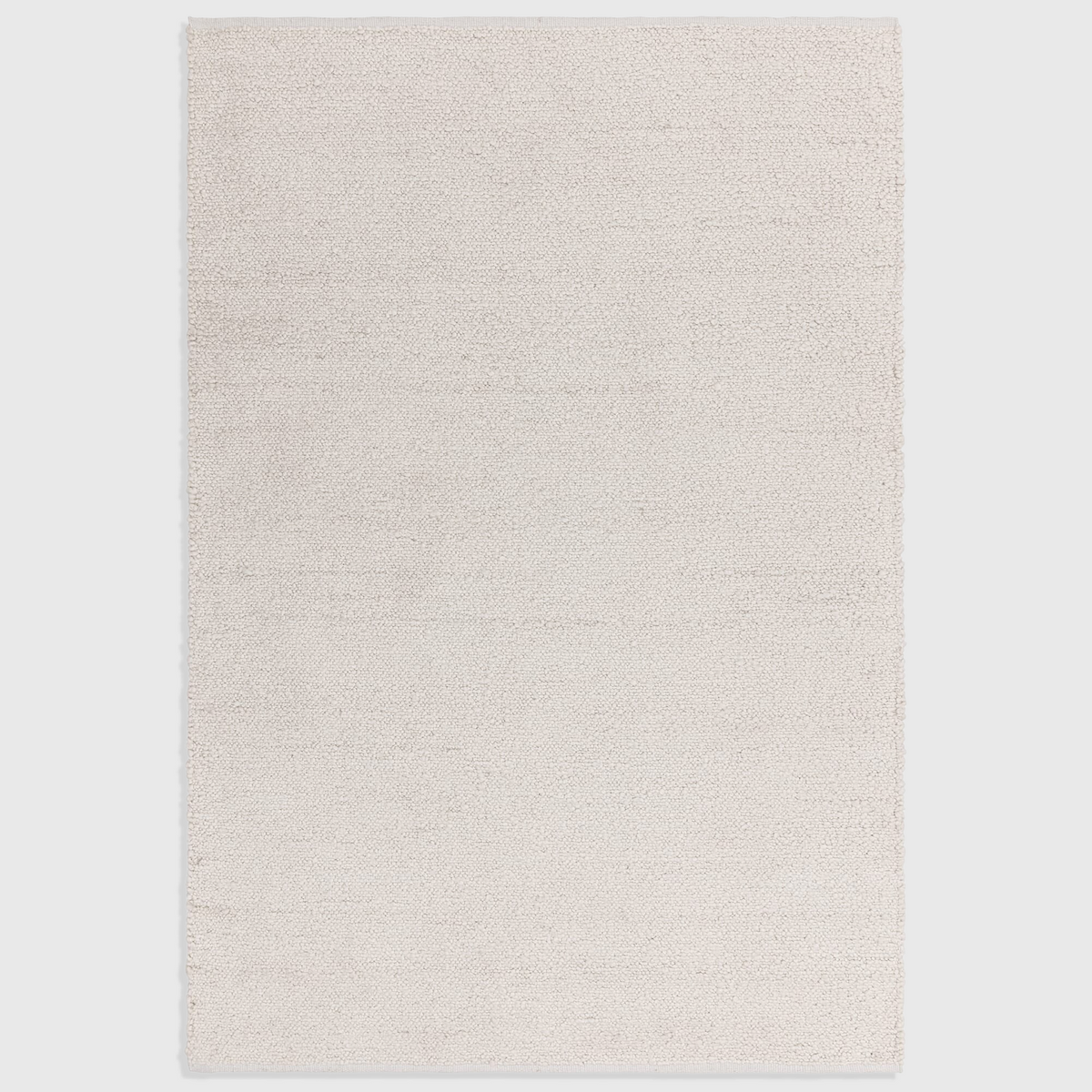 Alvo Rugs Abella ivory boucle rug with a textured hand-woven finish and boho style in 100% polyester.
