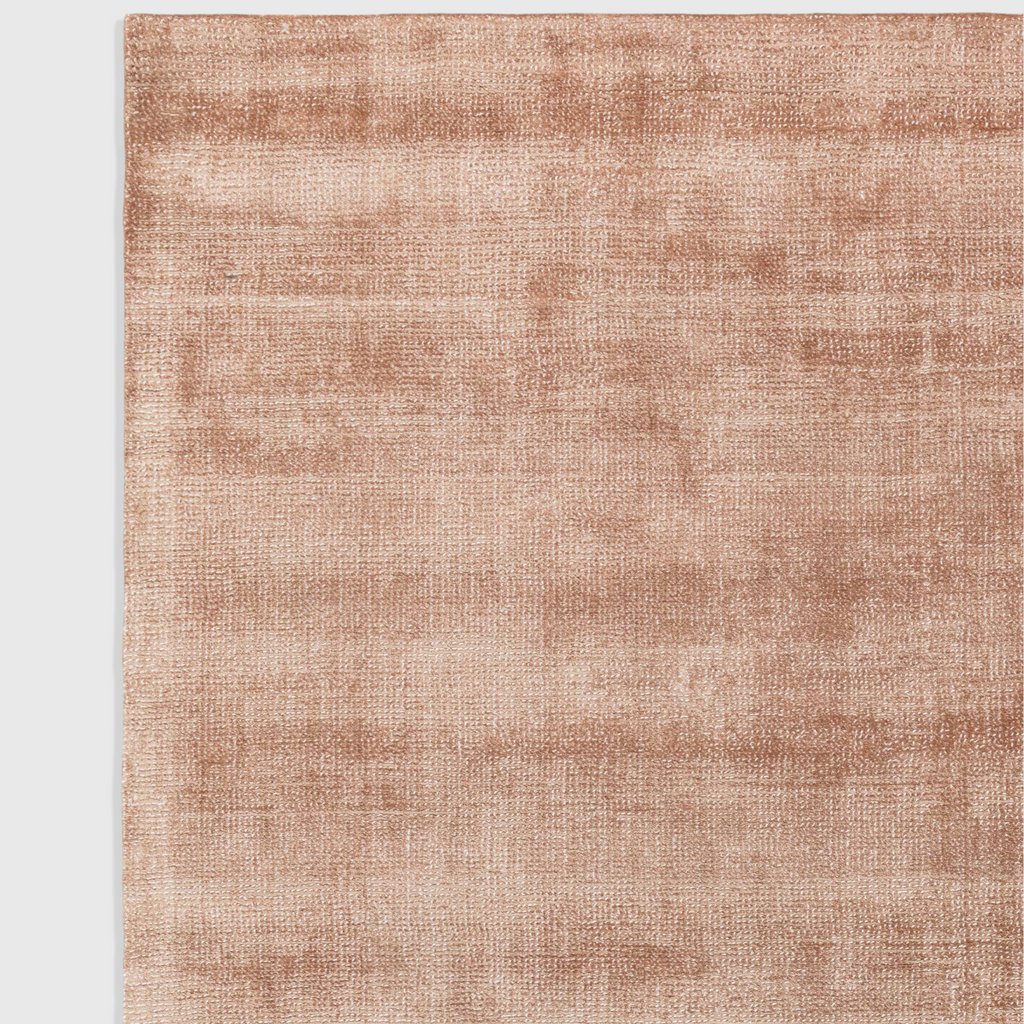 Alvo Rugs Astonia copper rug featuring a soft hand-woven viscose texture with a subtle sheen and loop pile finish.