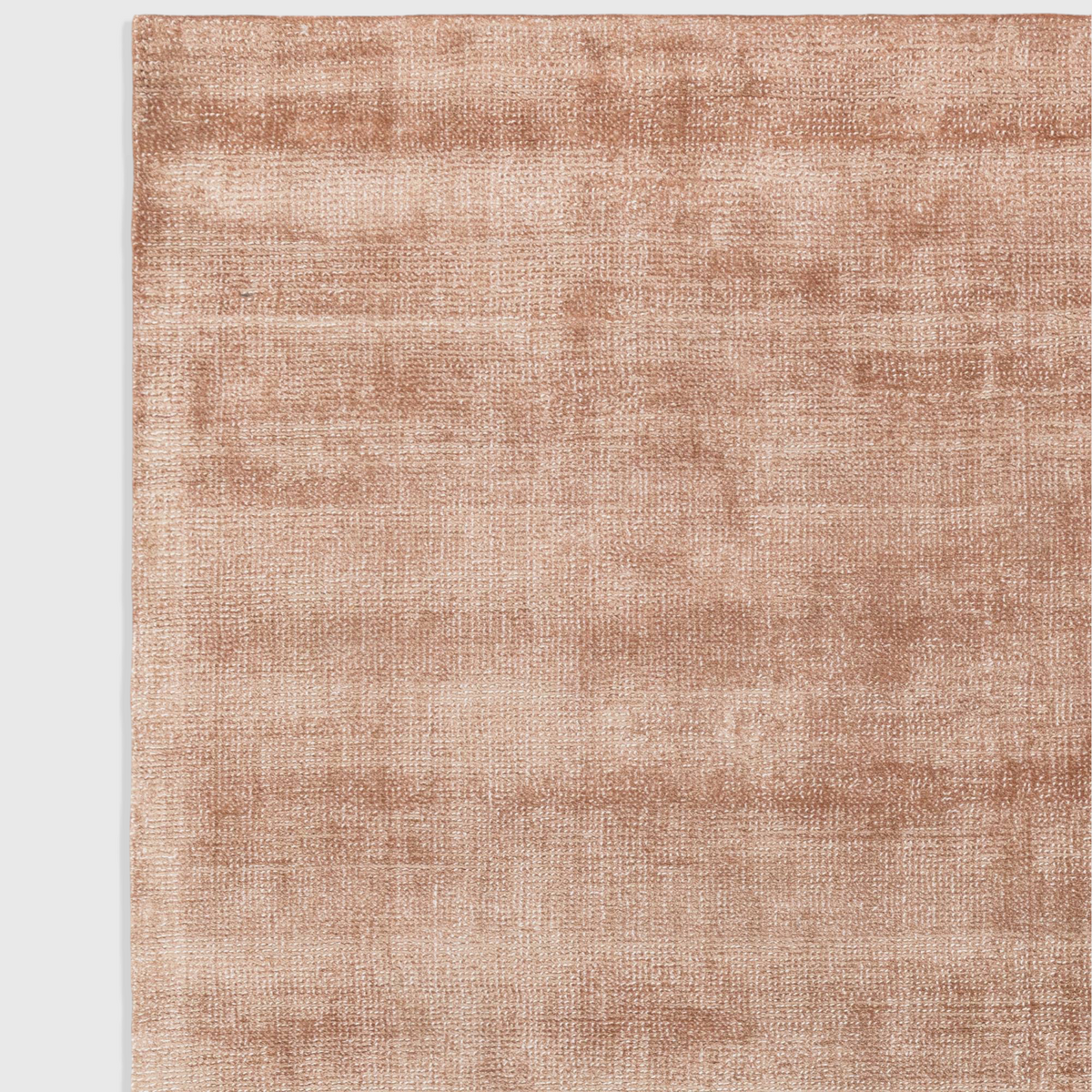 Alvo Rugs Astonia copper rug featuring a soft hand-woven viscose texture with a subtle sheen and loop pile finish.