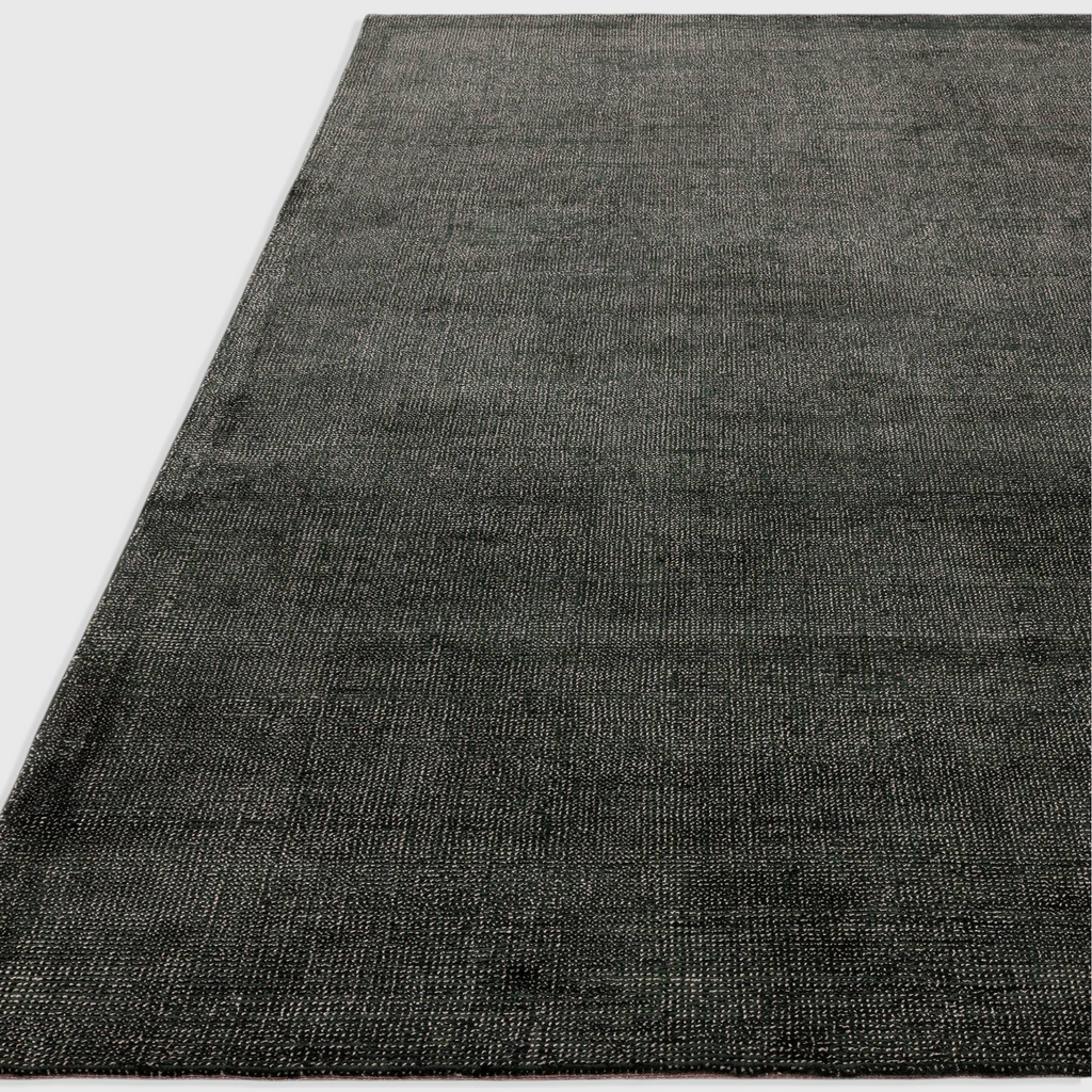 Alvo Rugs Astonia green hand-woven viscose rug with a subtle sheen and loop pile texture in a contemporary style.