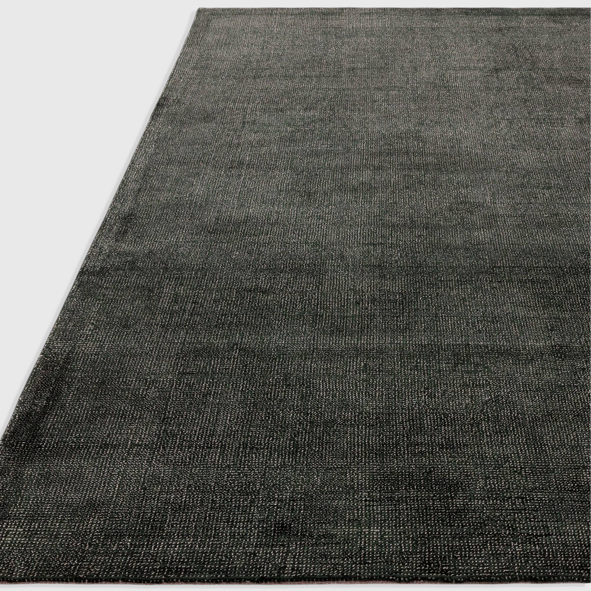 Alvo Rugs Astonia green hand-woven viscose rug with a subtle sheen and loop pile texture in a contemporary style.
