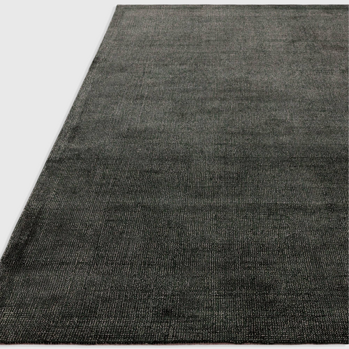 Alvo Rugs Astonia green hand-woven viscose rug with a subtle sheen and loop pile texture in a contemporary style.