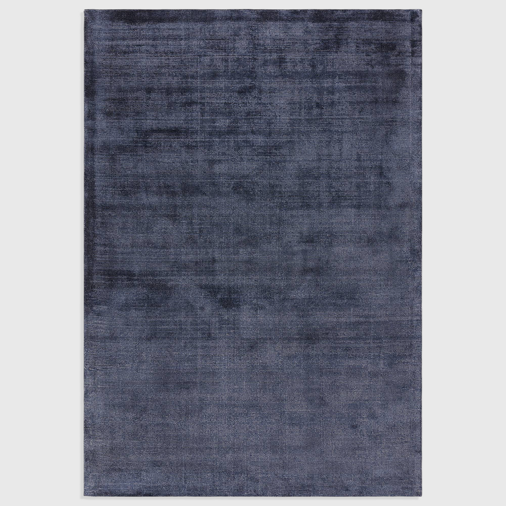 Alvo Rugs Astonia navy blue hand-woven viscose rug with a subtle sheen and soft loop pile texture.