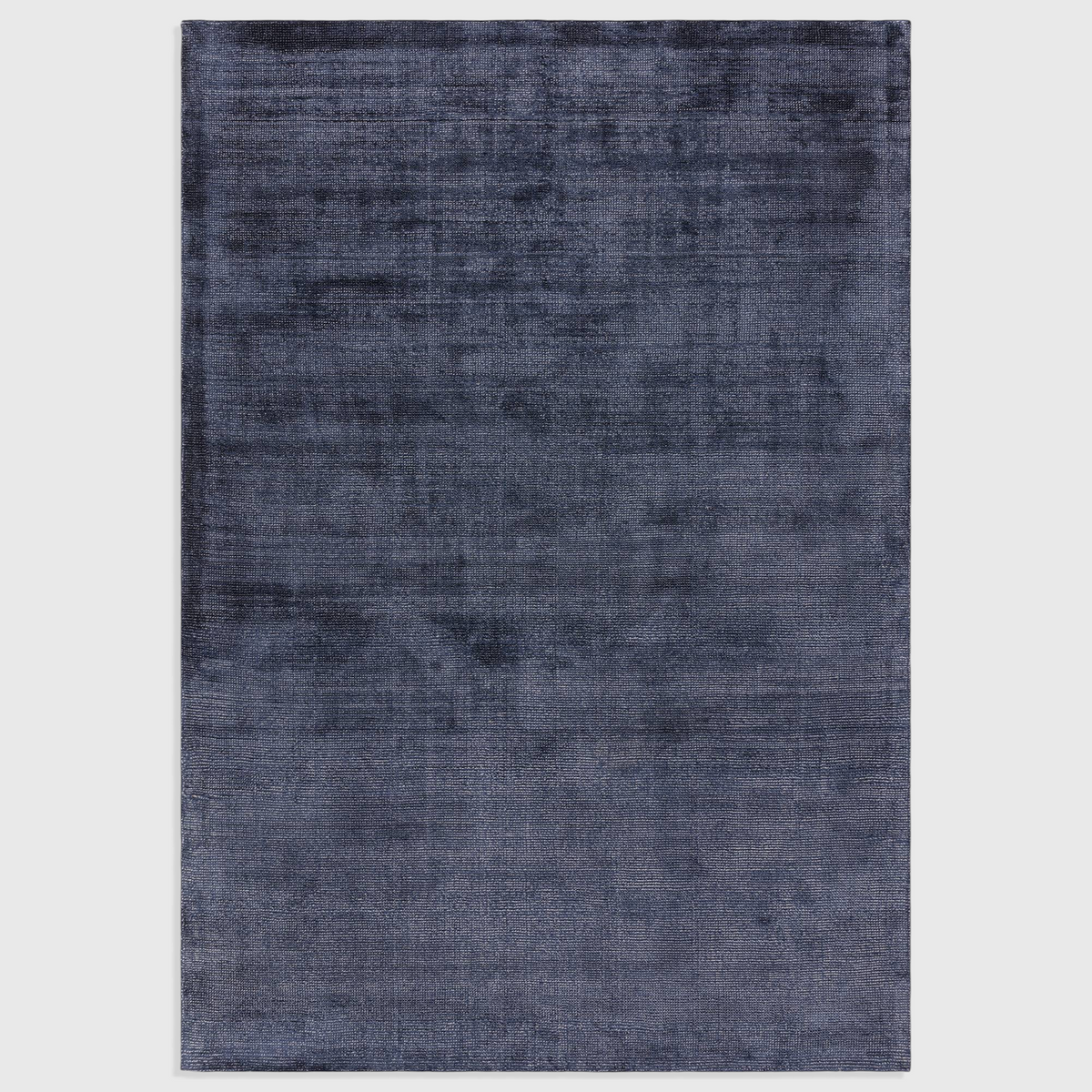 Alvo Rugs Astonia navy blue hand-woven viscose rug with a subtle sheen and soft loop pile texture.