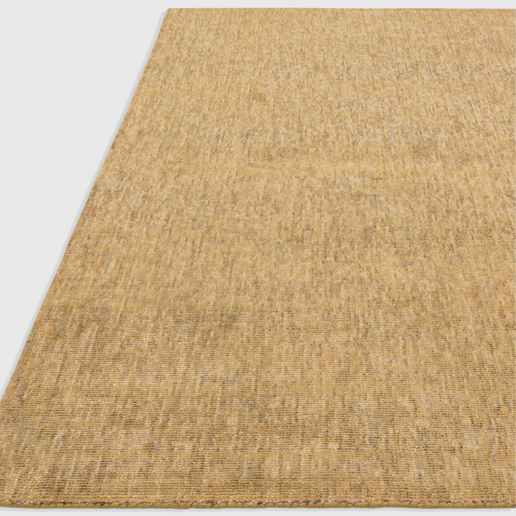 Alvo Rugs Astonia ochre yellow hand-woven viscose rug with a subtle sheen and loop pile texture.