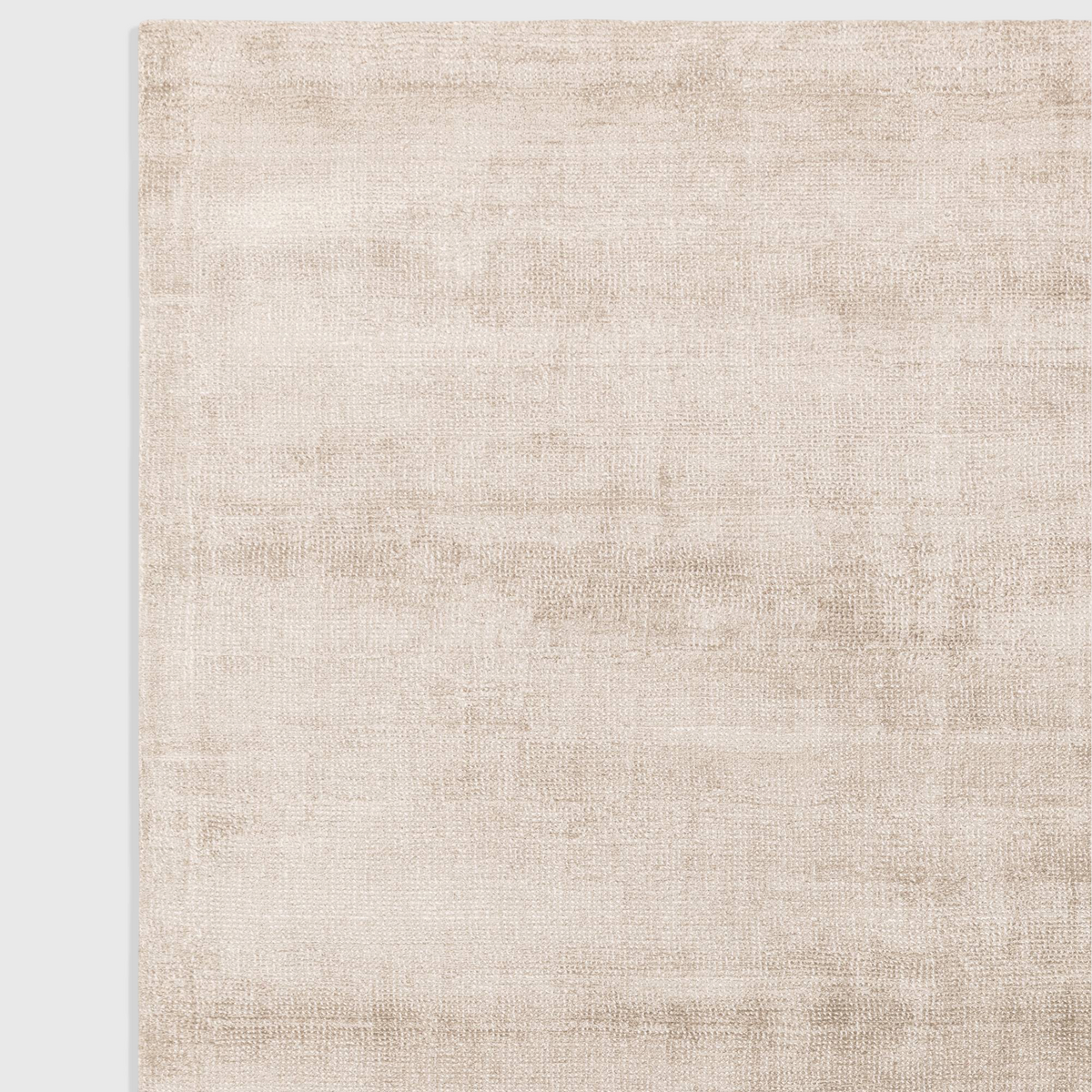 Alvo Rugs Astonia sand beige hand-woven viscose rug with a subtle sheen and loop pile texture.