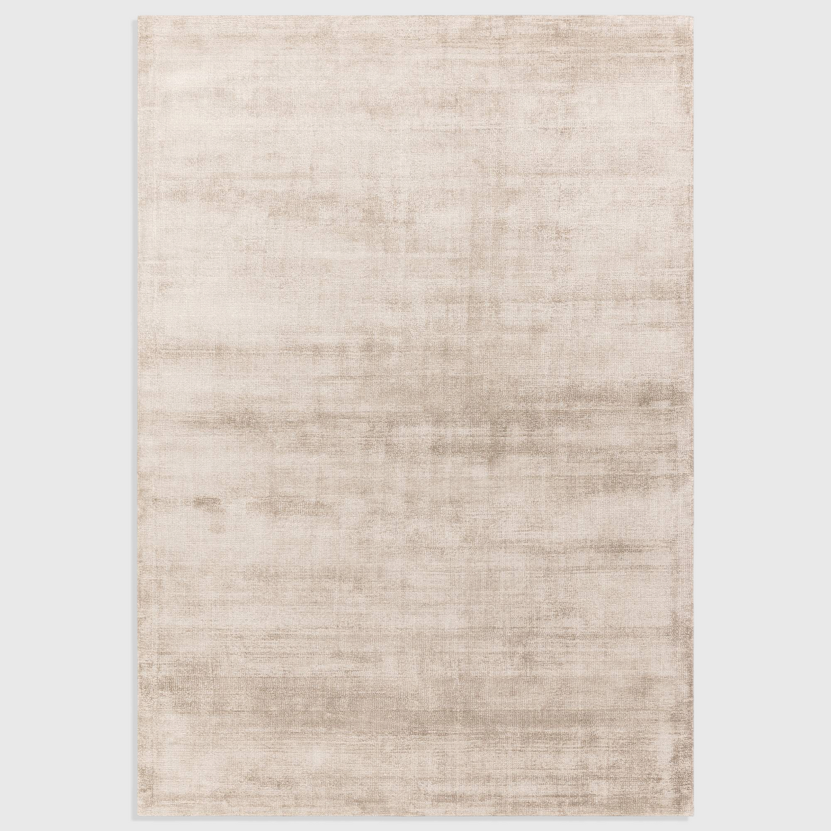 Alvo Rugs Astonia sand coloured hand woven viscose rug with a subtle sheen and plain loop pile texture.