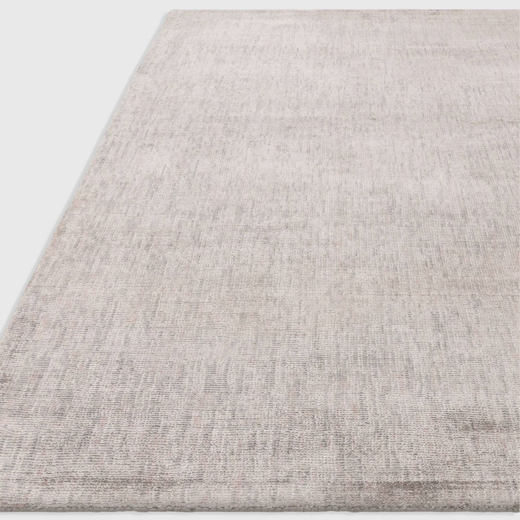 Alvo Rugs Astonia silver hand-woven viscose rug with a subtle sheen and loop pile texture in a contemporary style.