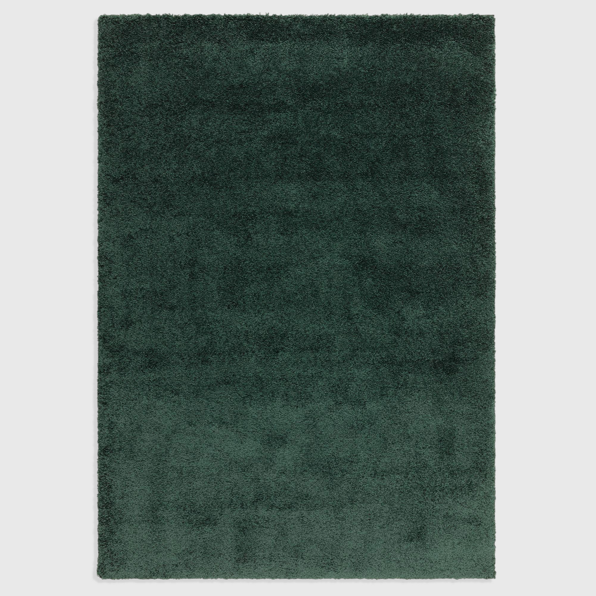 Alvo Rugs Atelier Emerald green shaggy rug with a thick, plush polypropylene pile and a soft, dense texture.
