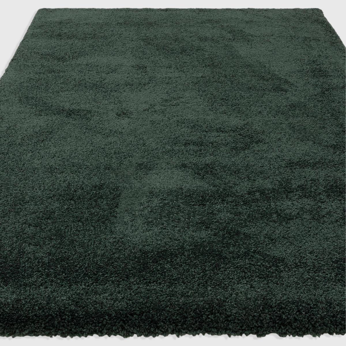 Alvo Rugs Atelier Emerald green shaggy rug with a thick, plush 4.5cm pile made from durable polypropylene.
