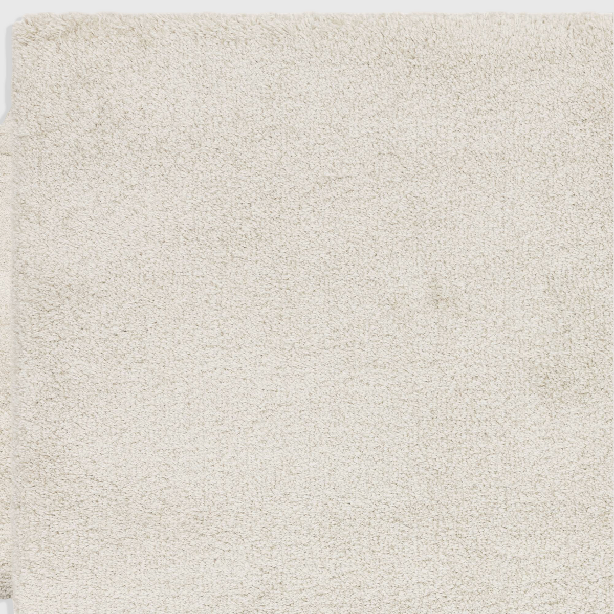 Alvo Rugs Atelier ivory shaggy rug with a thick, plush 4.5cm pile made from soft polypropylene.