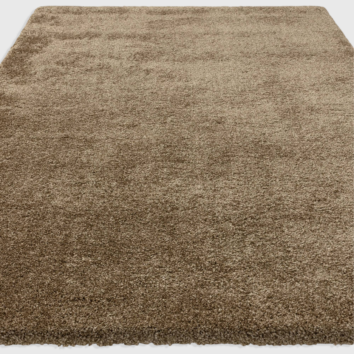 Alvo Rugs Atelier natural beige shaggy rug with a thick, plush polypropylene pile for a soft, cosy texture.