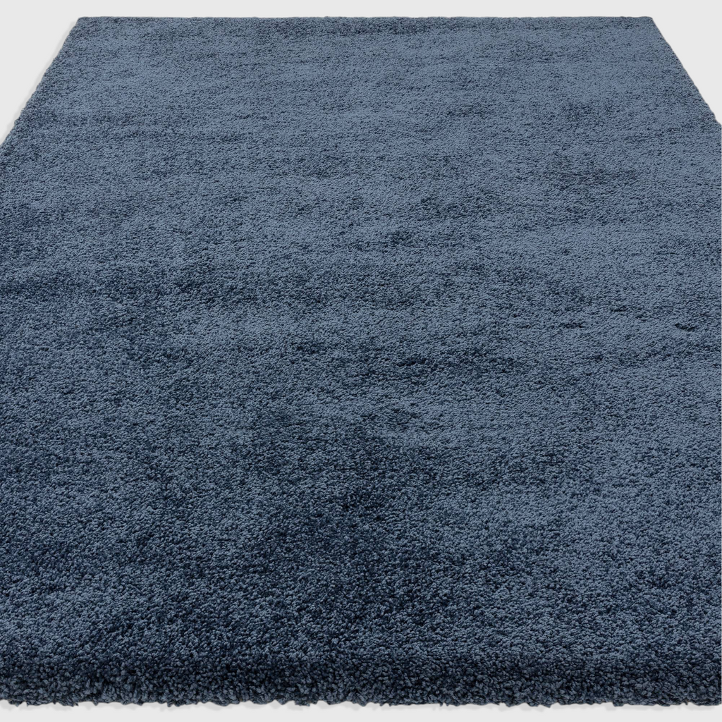 Alvo Rugs Atelier navy blue shaggy rug with a thick, plush pile and soft polypropylene texture.