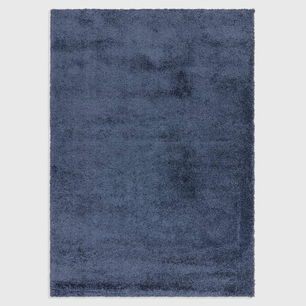 Alvo Rugs Atelier navy blue shaggy rug with a thick, plush polypropylene pile for a soft and cosy floor covering.