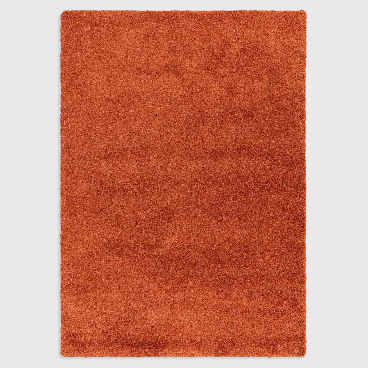 Alvo Rugs Atelier orange shaggy rug with a thick, plush 4.5cm pile made from durable polypropylene.