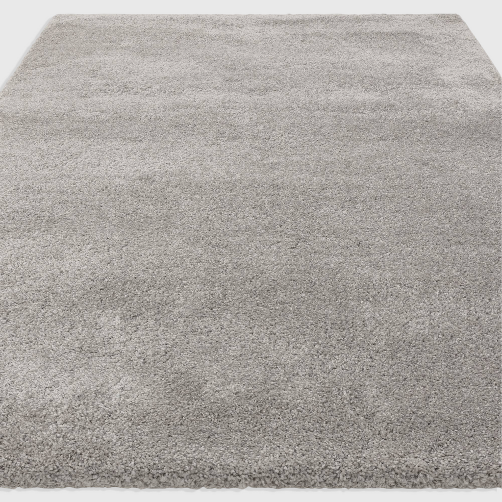 Alvo Rugs Atelier silver shaggy rug with a thick, plush polypropylene pile for a soft and cosy contemporary look.