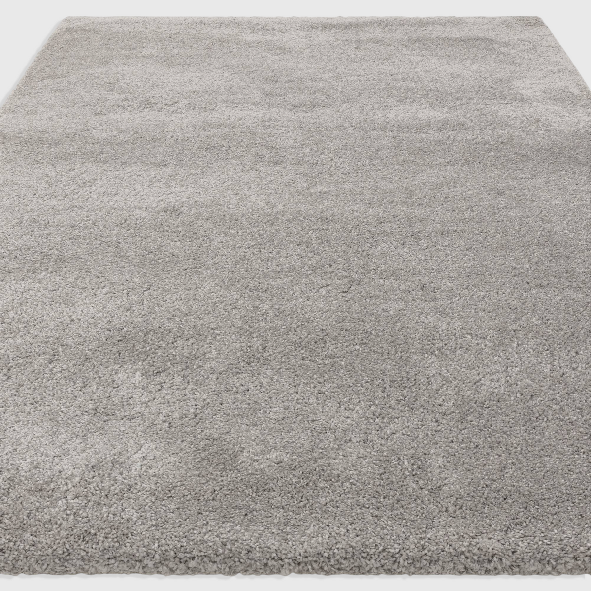 Alvo Rugs Atelier silver shaggy rug with a thick, plush polypropylene pile for a soft and cosy contemporary look.