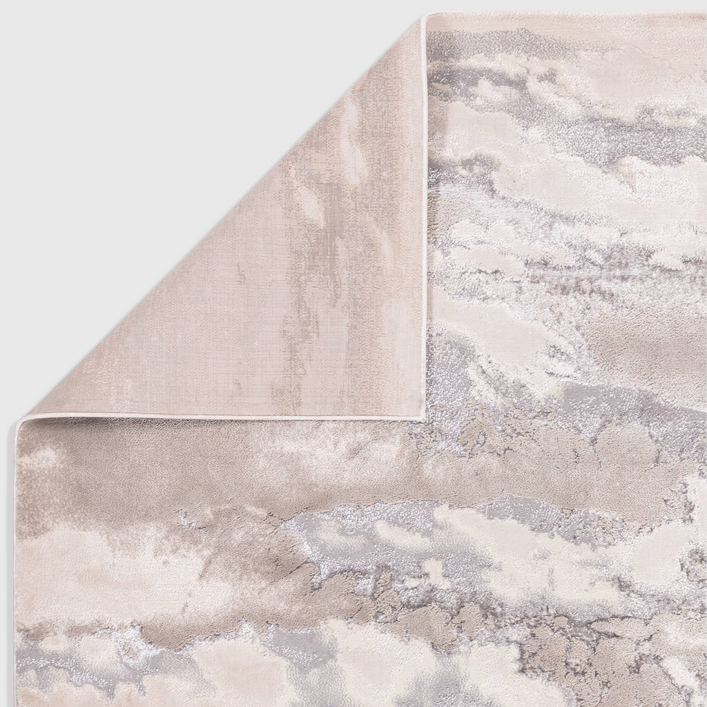Alvo Rugs Aurorella Au02 Cloud rug in grey and silver with an abstract metallic design and folded corner detail.
