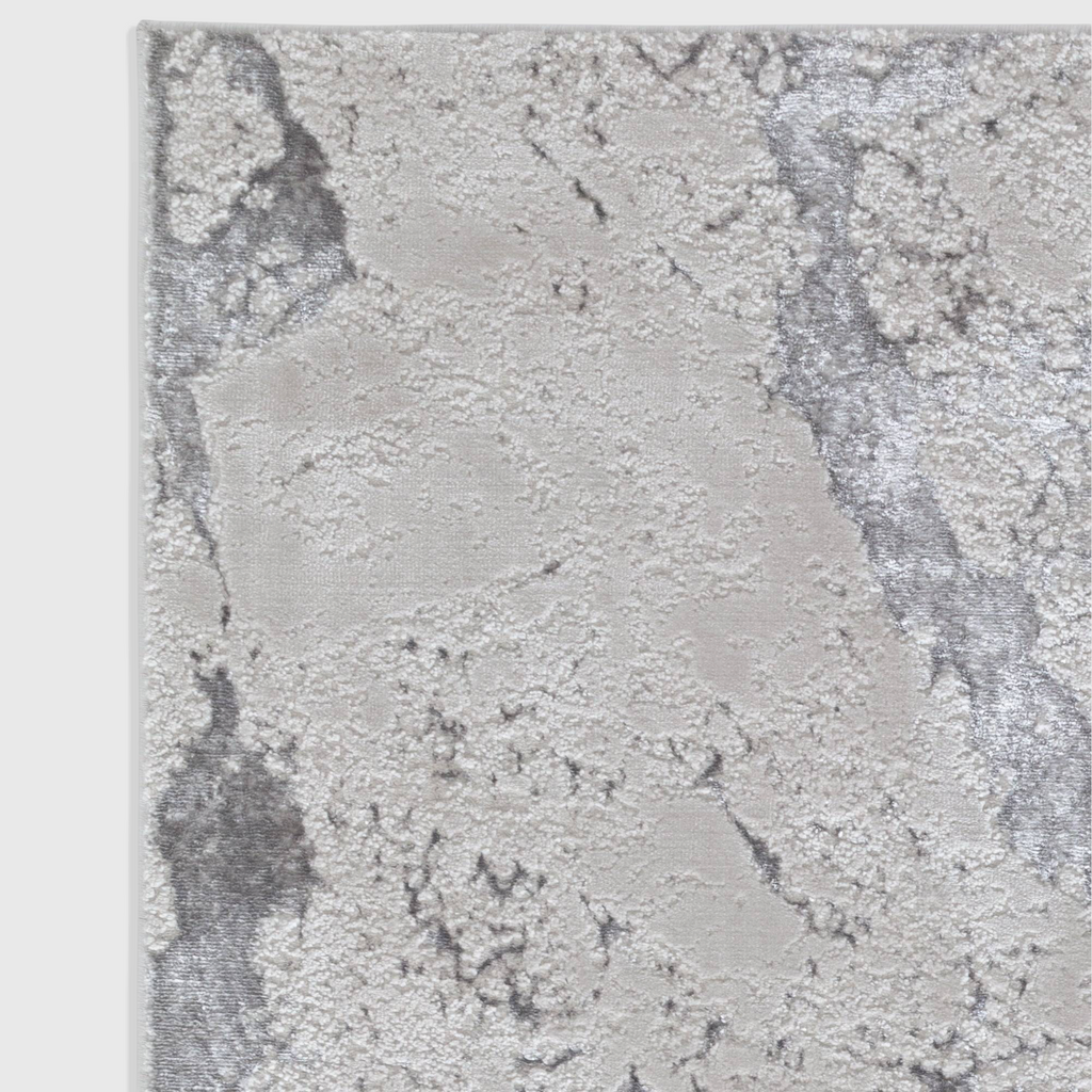 Alvo Rugs Aurorella Au03 Solar rug featuring a grey and silver abstract metallic design with a soft cut pile texture.