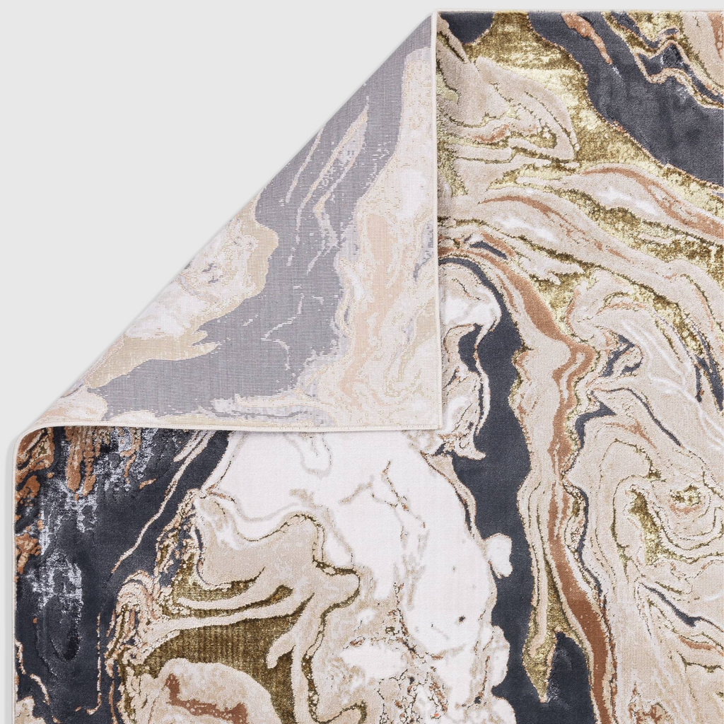 Alvo Rugs Aura marble rug featuring abstract grey, beige, and metallic gold patterns with a folded corner detail.