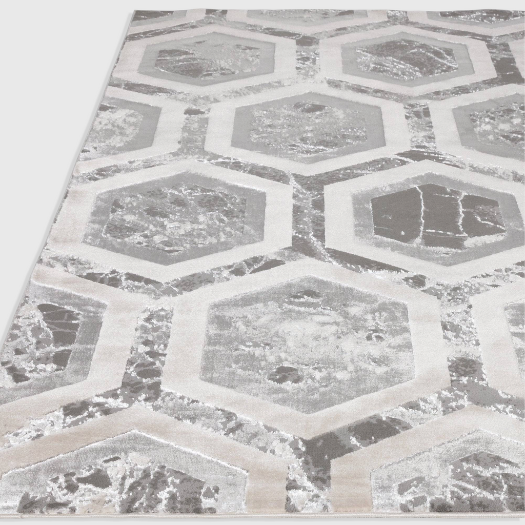 Alvo Rugs Aurorella Au12 Crystal rug featuring a modern grey and silver abstract hexagonal pattern in cut pile.