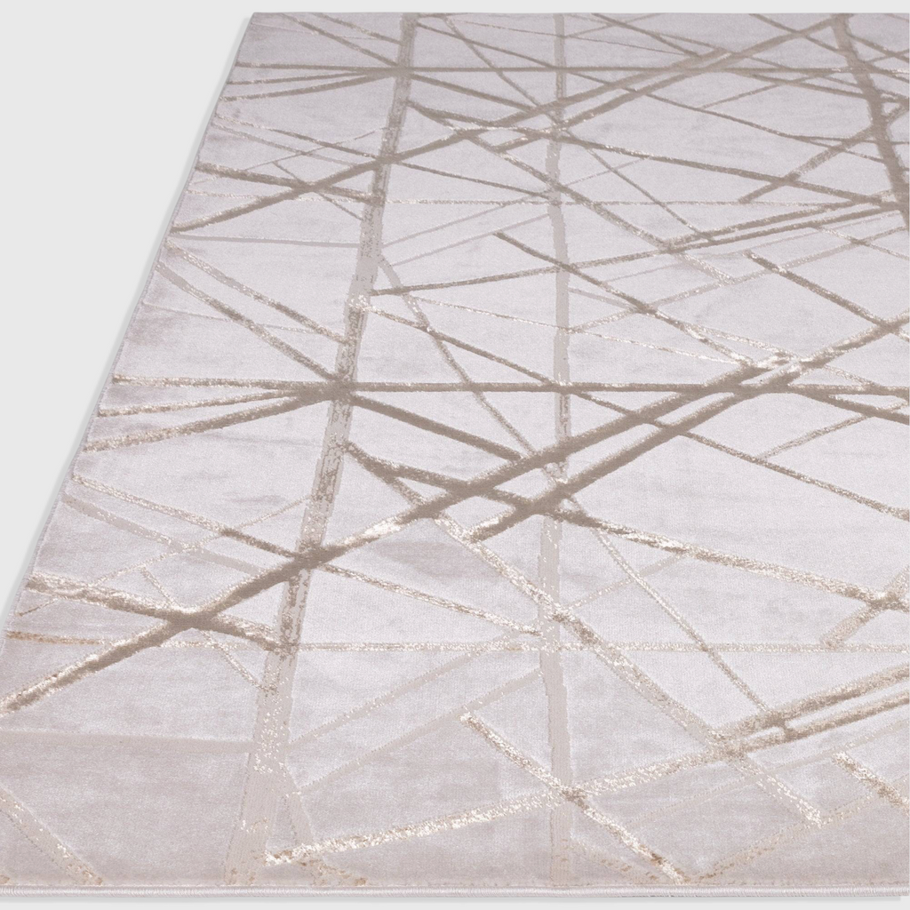 Alvo Rugs Aurorella Au13 Mica rug featuring a modern abstract metallic gold geometric pattern on a soft light base.