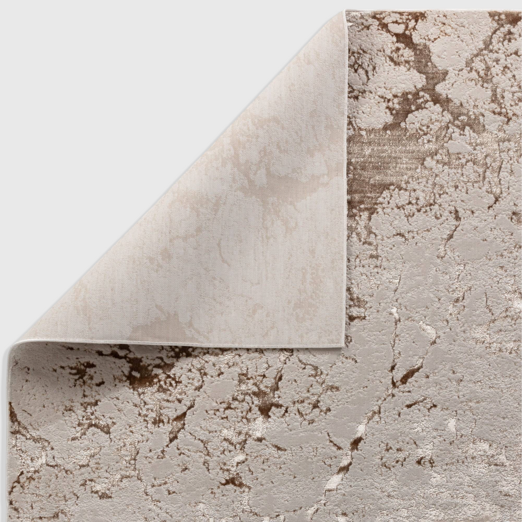 Alvo Rugs Aurorella Au16 Strata rug with abstract gold and beige metallic pattern and visible jute backing corner