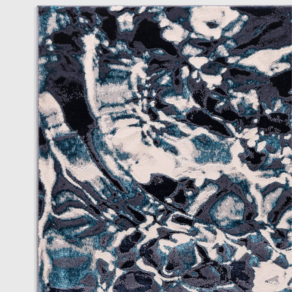Alvo Rugs Aurorella Foam Au21 abstract area rug featuring deep blue and white metallic tones in a soft cut pile finish.