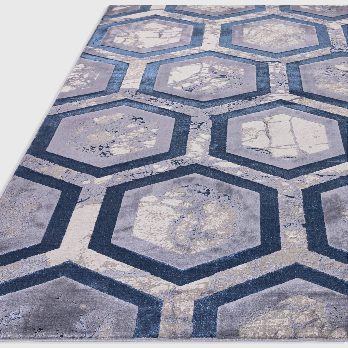 Alvo Rugs Aurorella Hexagon Au19 rug featuring a modern blue and grey geometric pattern with a soft cut pile finish.