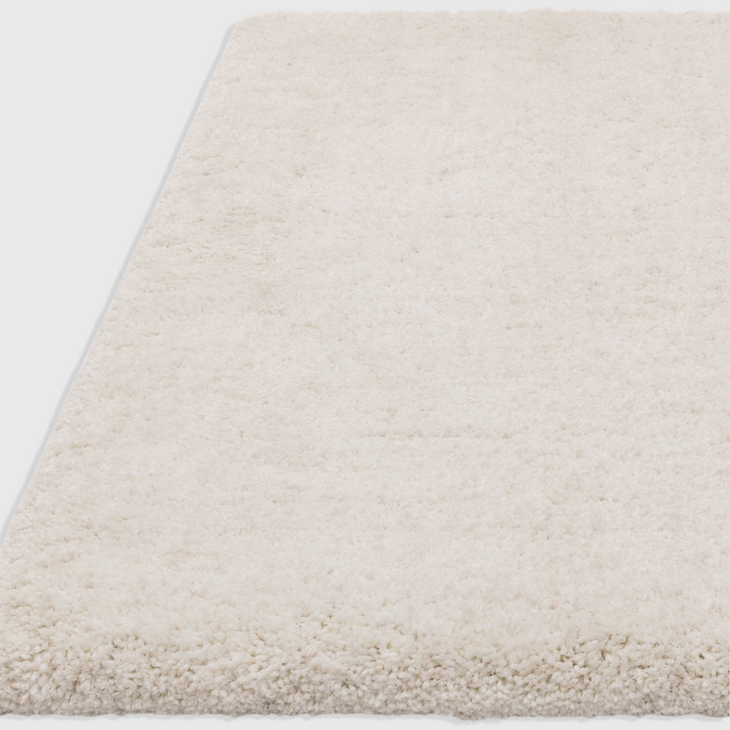Alvo Rugs Barnett off-white shaggy rug with a deep, soft microfibre polyester pile and hand-woven texture.