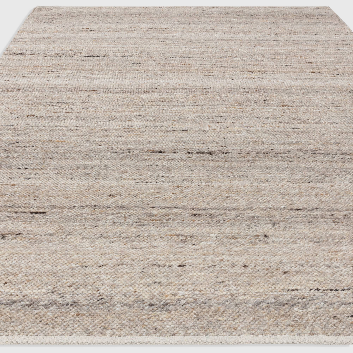 Alvo Rugs Birkley beige hand-woven flatweave rug with natural wool and polyester texture and subtle colour striations.