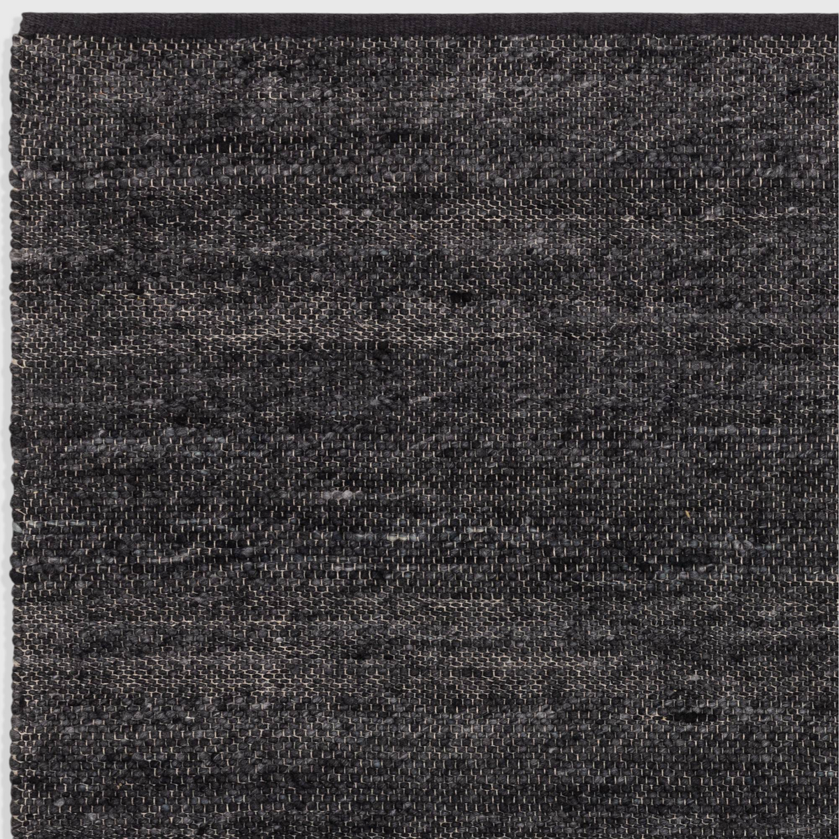 Alvo Rugs Birkley Indigo rug featuring a hand-woven dark blue wool and polyester flatweave texture.