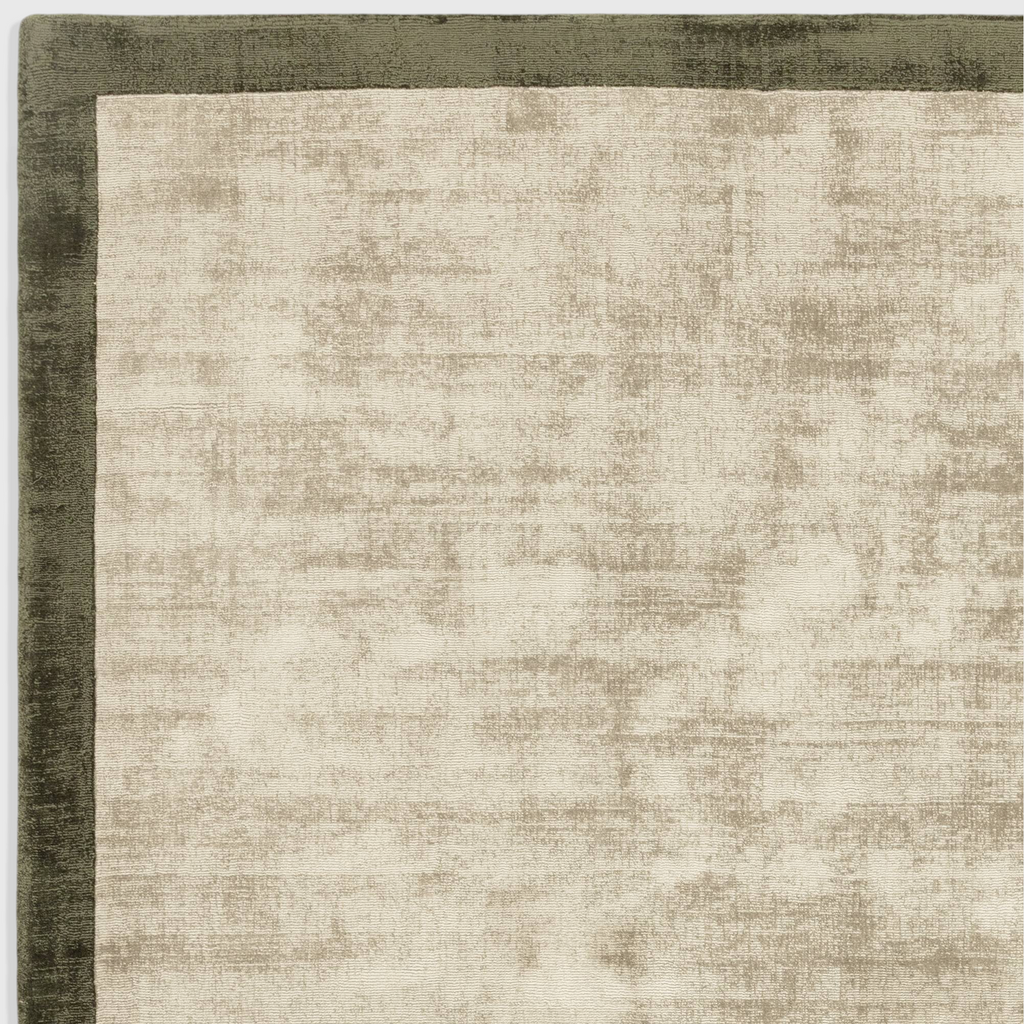 Alvo Rugs Blayde sage and olive green hand-woven viscose rug with a two-tone border and soft tip-sheared texture.