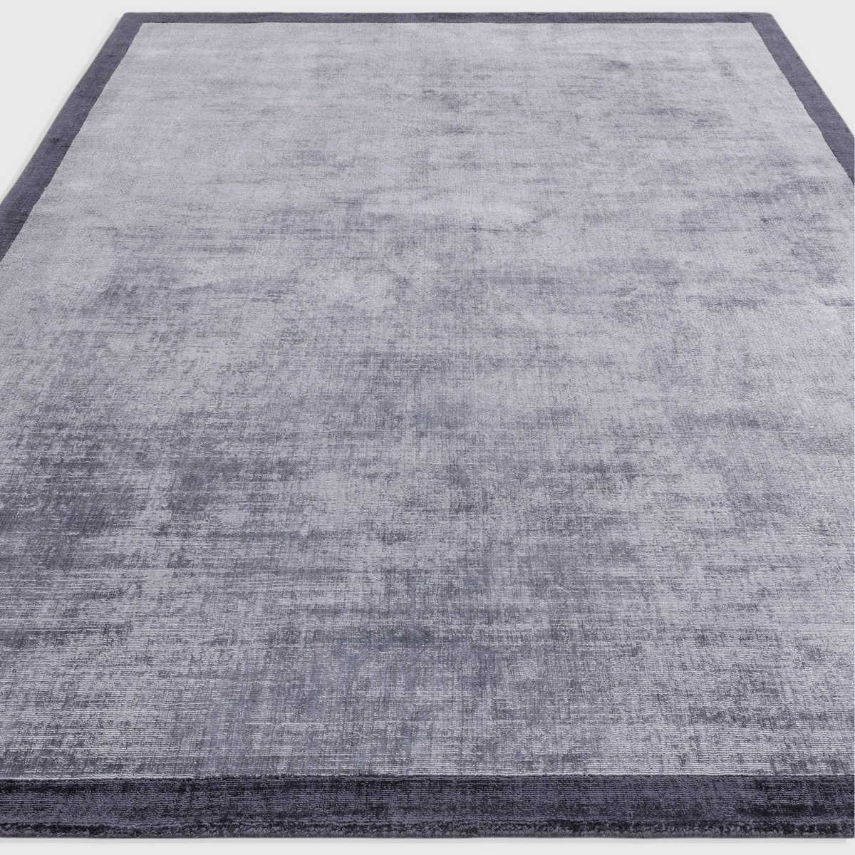 Alvo Rugs Blayde hand-woven viscose rug in airforce and navy blue with a two-tone border and tip-sheared texture.