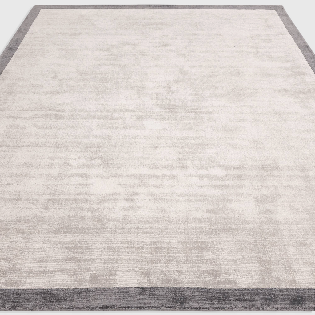 Alvo Rugs Blayde silver and grey hand-woven viscose rug with a two-tone border and soft tip-sheared texture.