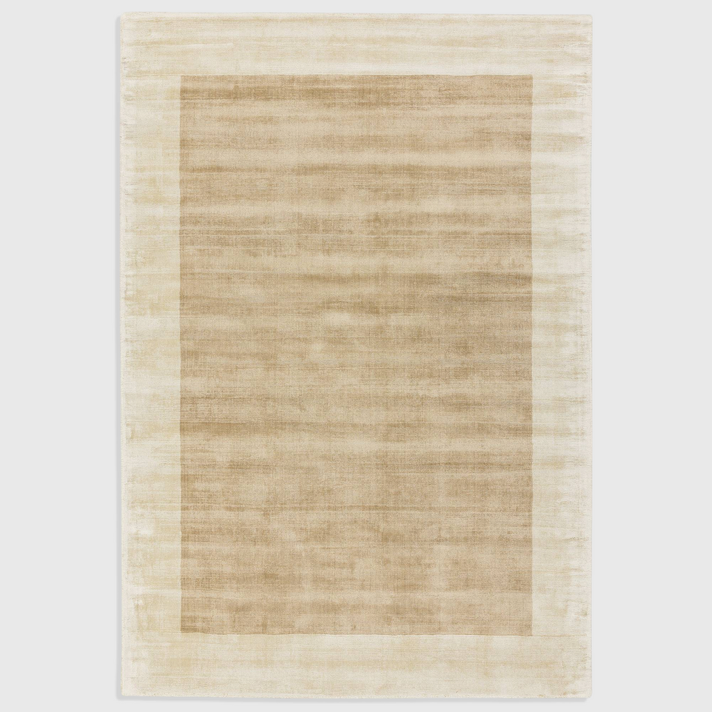 Alvo Rugs Blayde handwoven viscose rug in putty and champagne with a thick contrasting border and tip-sheared finish.