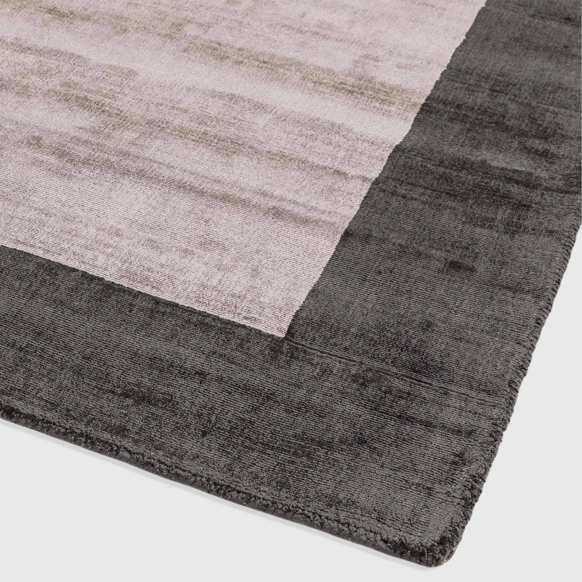 Alvo Rugs Blayde charcoal and silver handwoven viscose rug with a thick contrasting border and tip-sheared texture.