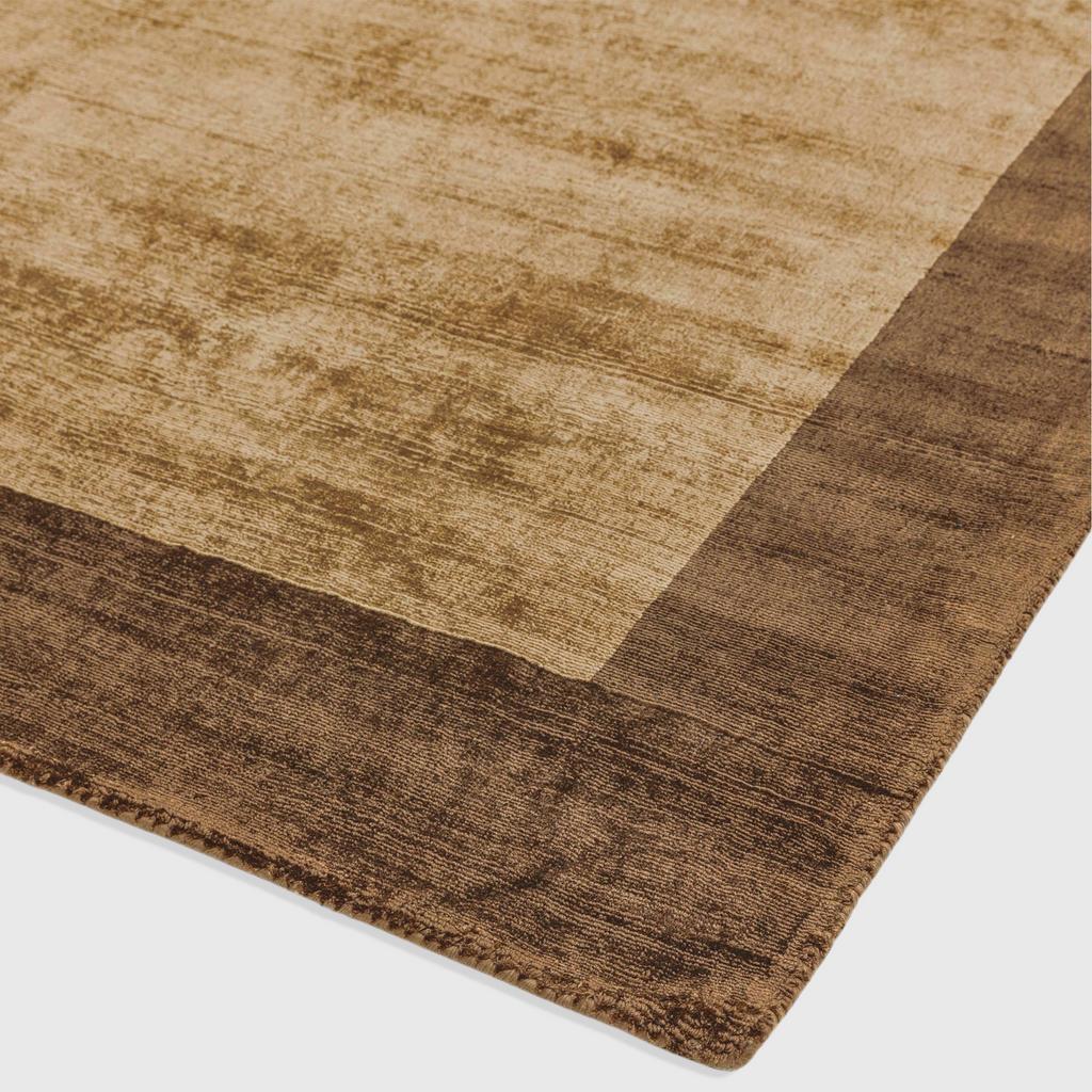 Alvo Rugs Blayde handwoven viscose rug in choco and mocha brown with a thick contrasting border and tip-sheared finish.