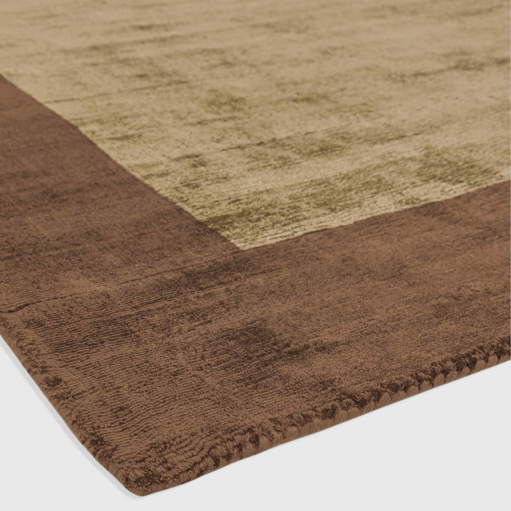 Alvo Rugs Blayde Choco and Mocha handwoven viscose rug featuring a thick contrasting border and soft loop pile texture.