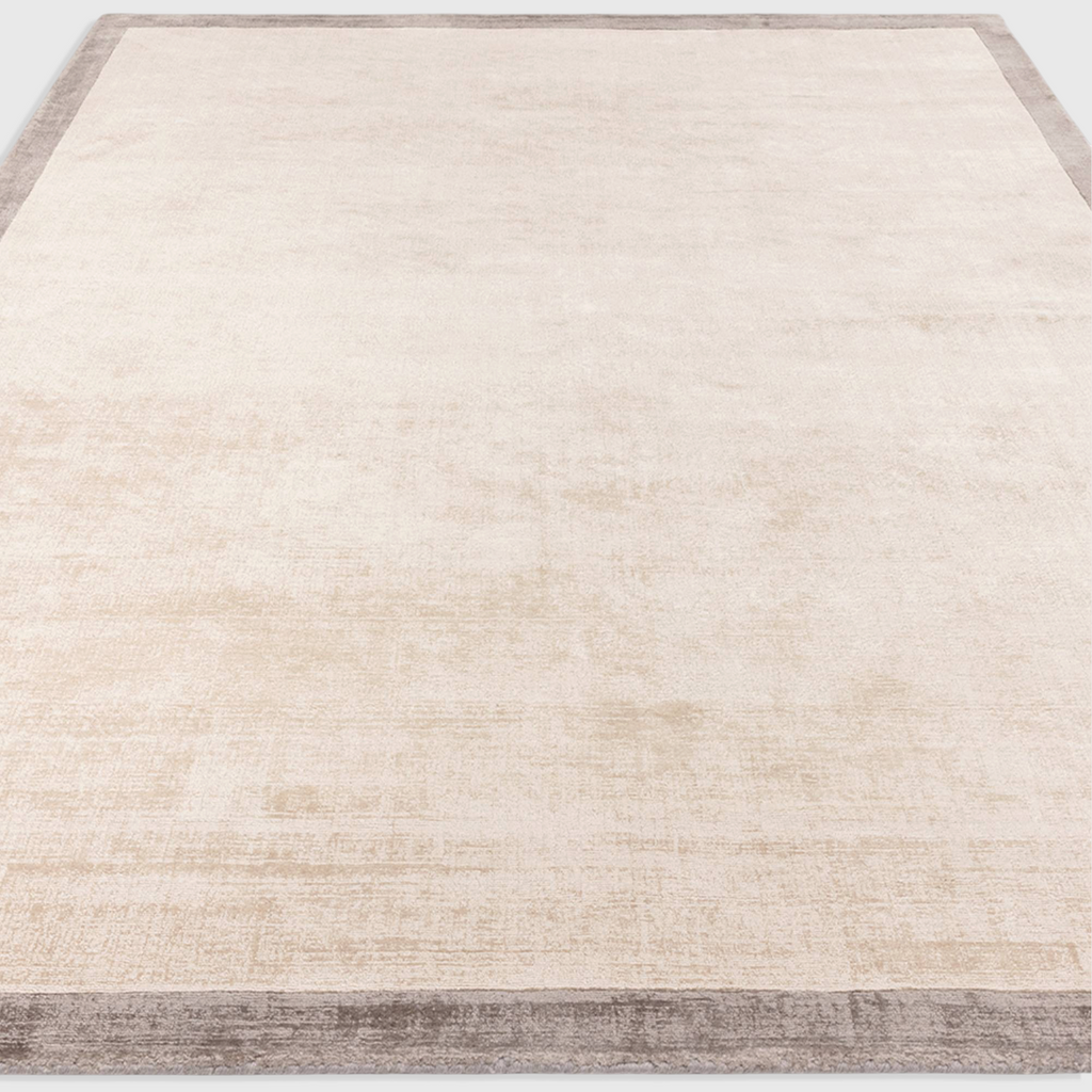 Alvo Rugs Blayde hand-woven viscose rug in putty and silver with a two-tone border and soft tip-sheared texture.