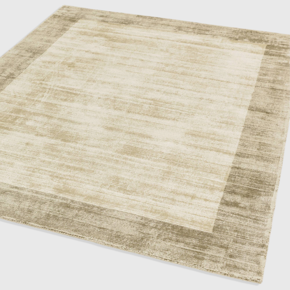 Alvo Rugs Blayde handwoven viscose rug in smoke and putty with a contrasting border and tip-sheared texture.