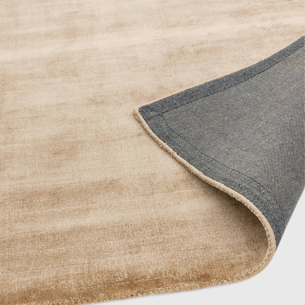 Alvo Rugs Blayde champagne beige hand-woven viscose rug showing the soft pile texture and dark grey latex backing